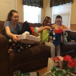 Children opening gifts